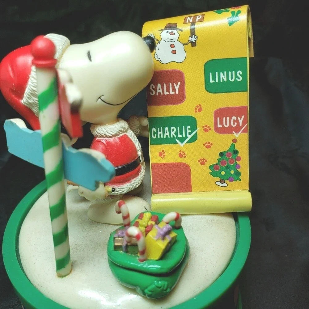 Snoopy as Santa checking his List‎ Music Box Play We Wish You A Merry Christmas
